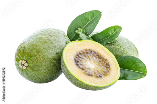 a close up of a green fruit with leaves