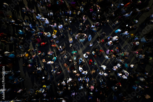 crowd people background. aerial shot of the people gathered for an event. disco night people dancing in the crowd top view. mass people gathered to celebrate an event. people are blurred into motion.