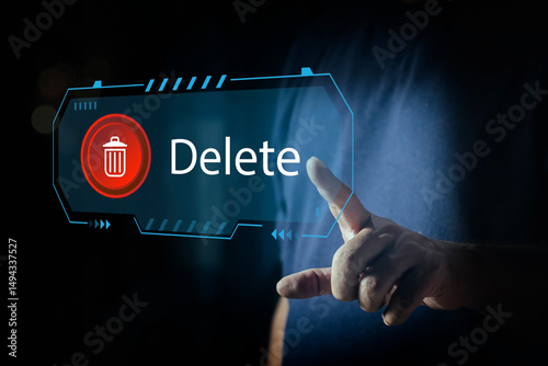 Man pushing the delete button on virtual screen. The concept of deletion or erase contacts, Deleting files from the system. Spam mail, electronic messages or personal data in computer systems.