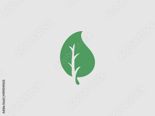 A simple illustration of a solid green leaf with a stylized white vein pattern on a light gray background