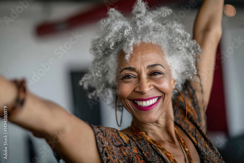 Happy mature woman dancing in a industry photo