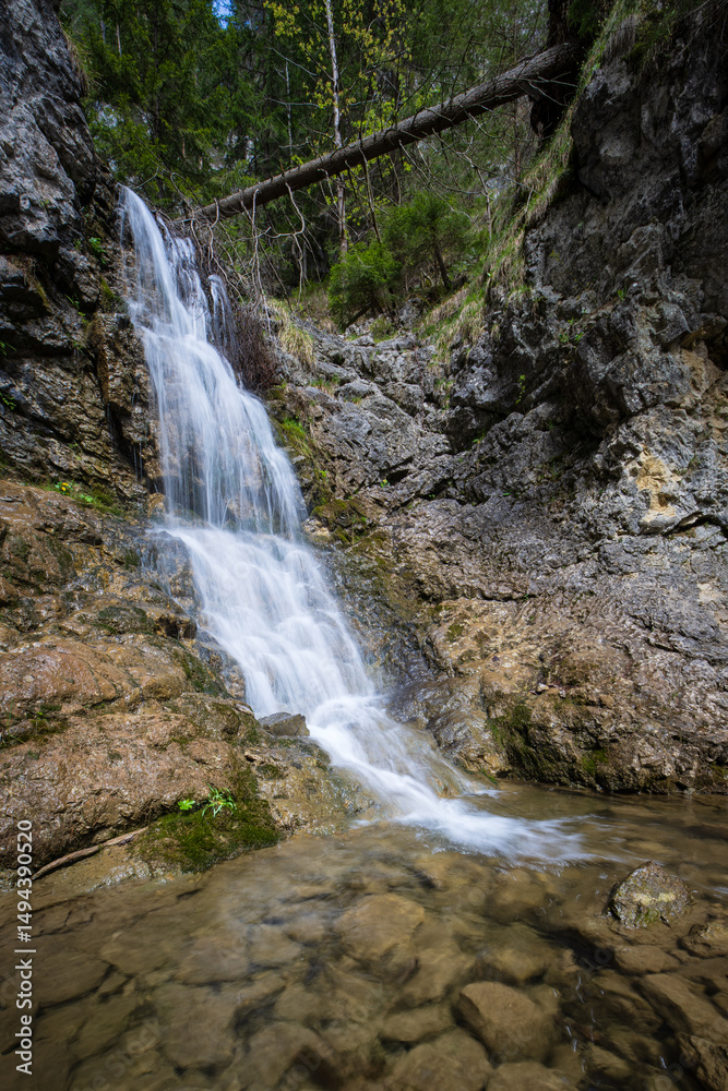 Naklejka premium Forest waterfall on the river Borovianka, flowing through Kvacianska valley.
