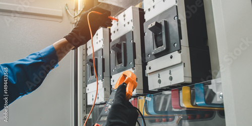 Electrical equipment maintenance service engineer Engineers carry AC voltmeters to check voltage at breaker terminals and inspect switchgear.