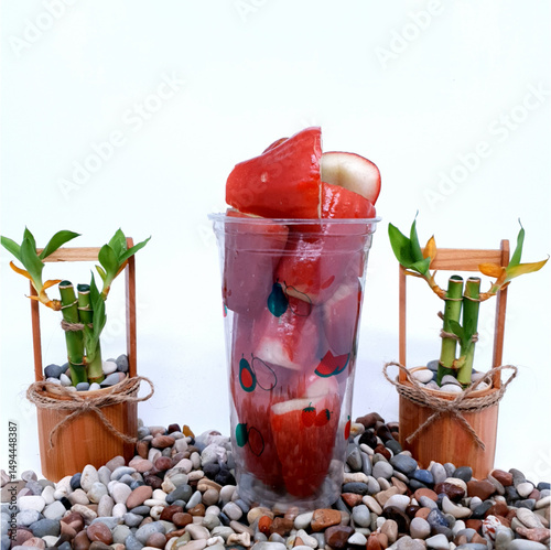 Red and Mojito Cocktails with Ice and Mint on a Table