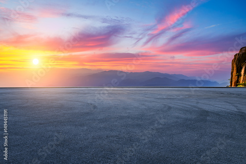 Empty asphalt road and mountain with beautiful sky clouds at sunset