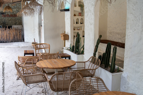 Tranquil Beachfront Cafe: Rattan Furniture and Cactus Decor