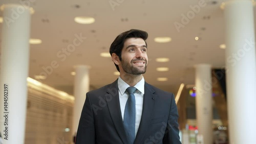 Wallpaper Mural Caucasian smart business man looking at watch while waiting colleague. Executive manager wearing suit while standing at mall with blurred background. Investor wear blue suit checking time. Exultant. Torontodigital.ca