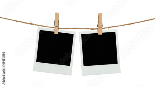 Two blank Polaroid photo frames clipped to a rope with wooden pegs, isolated on transparent background, perfect for nostalgia-themed designs, scrapbooks, or memory placeholders.