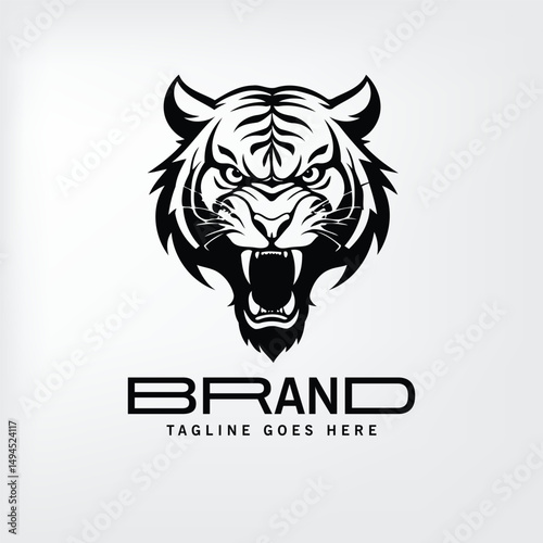 Tiger head logo with brand name and tagline. Intense, roaring tiger head graphic with a professional brand name and tagline, ready for corporate use.