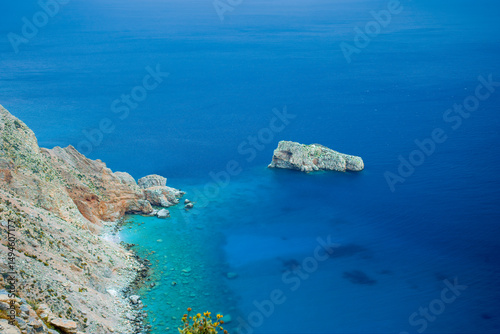 Turquoise Waters and Rocky Cliffs of a Remote Island in the Aegean Sea, Greece – Aerial Coastal Landscape with Crystal-Clear Blue and Green Sea