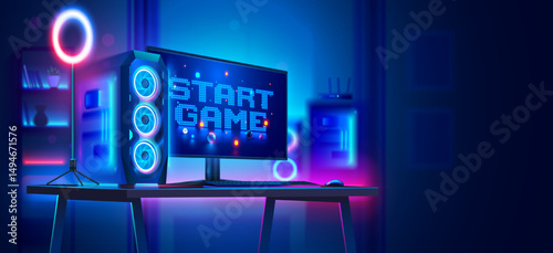 Powerful gaming computer on the table with the inscription the start game on the monitor. Gaming computer in an empty dark room in neon light. Nobody at the computer. Desktop PC for video game.