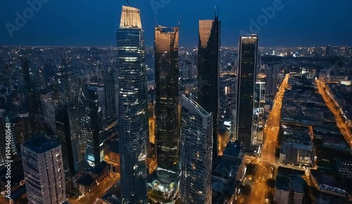 Wallpaper Mural The aerial view of the city center, filled with shimmering high-rise towers at blue hour, comes to life as the camera slowly pans across the skyline Torontodigital.ca