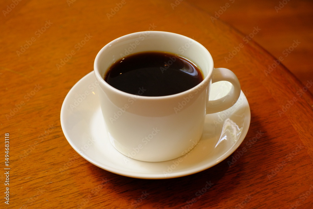 Obraz premium cup of coffee on wooden table 