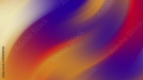 Blurry abstract background with shades of purple red orange and yellow.