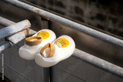 Abandoned children's clogs industrial setting urban environment close-up perspective