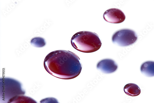 a bunch of red and blue bubbles floating in water