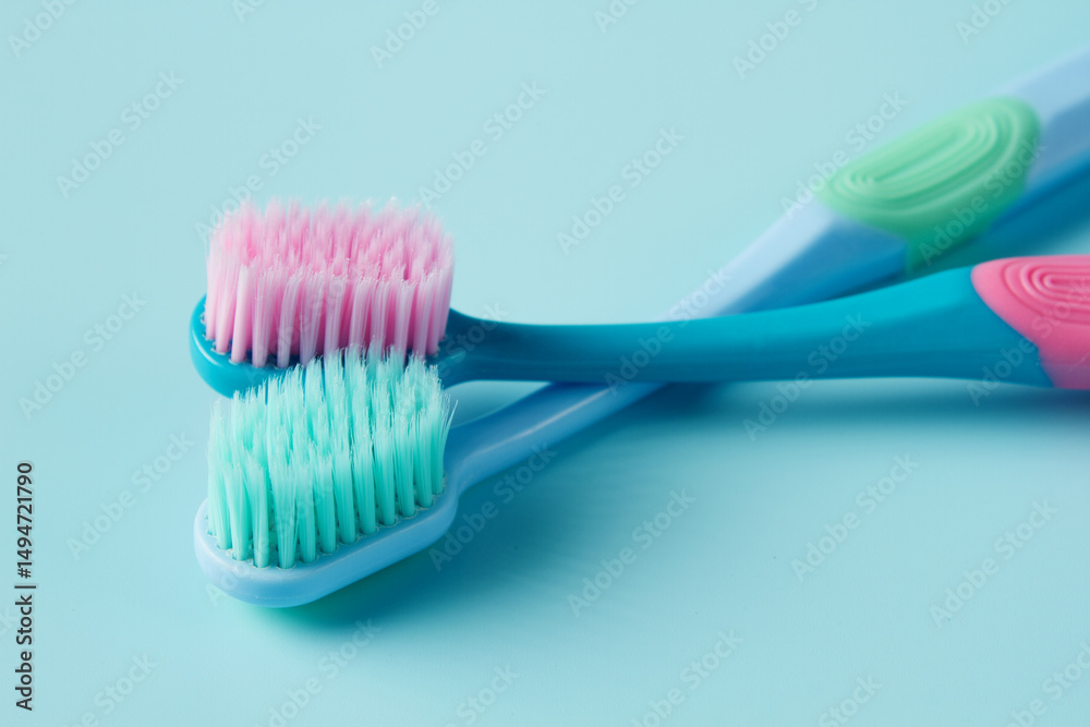 Toothbrushes on blue background. Oral hygiene concept Toothbrushes on blue background. Oral hygiene concept