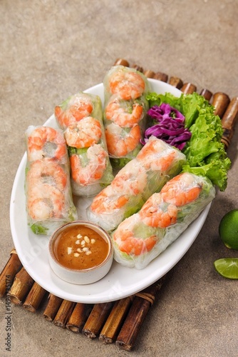 Gỏi cuốn, Vietnamese spring rolls, summer spring rolls, or salad spring rolls, a traditional dish in Vietnamese cuisine consisting of chicken, shrimp, vegetables, bún, and other ingredients wrapped in