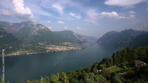 Time-lapse panorama of eastern Lake Como with mountains and Mandello del Lario and Lecco in background