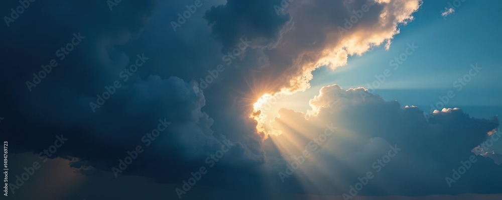 Fototapeta premium Sunbeam explodes through dark storm clouds, vibrant blue sky visible , contrast, atmospheric