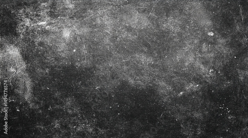A dark and textured surface with visible scratches and fingerprint patterns creating a distressed look