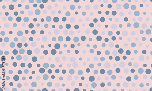 Abstract pastel pink background with scattered blue and light blue circles of varying sizes.  Perfect for website banners, textile design, or playful branding.