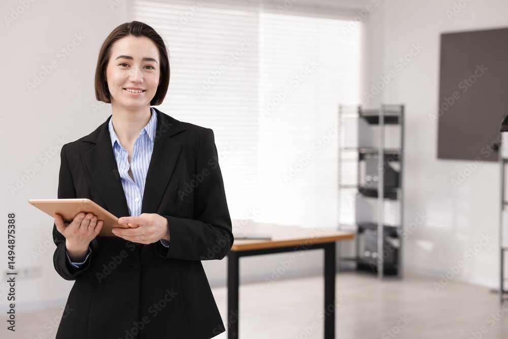 Happy recruiter with tablet in office, space for text Happy recruiter with tablet in office, space for text