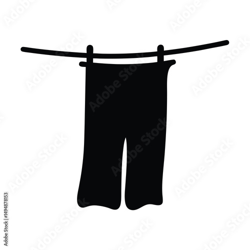 A simple image of a pair of pants hanging on a clothesline