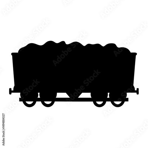 Silhouette of a vintage coal mine train car fully loaded with ore