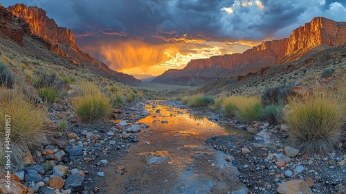 Dramatic canyon sunset reflecting in a shallow stream