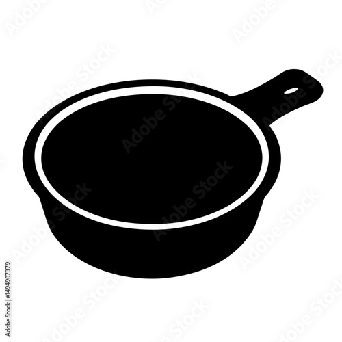 Monochrome image of a cast iron skillet or cooking pan with handle