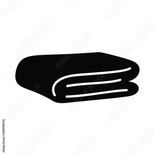 Solid black icon of neatly folded towel or soft fabric material