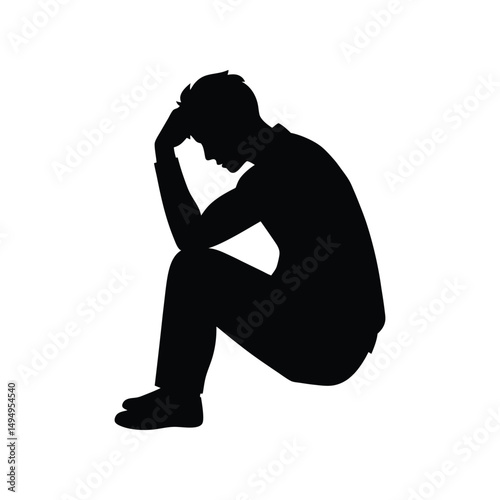 Silhouette of a Man Seated, Head in Hands, Expressing Despair and Grief