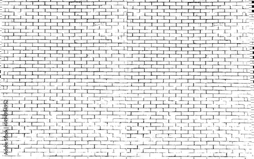 A black and white grungy brick wall. Dilapidated brick pattern in black and white. 