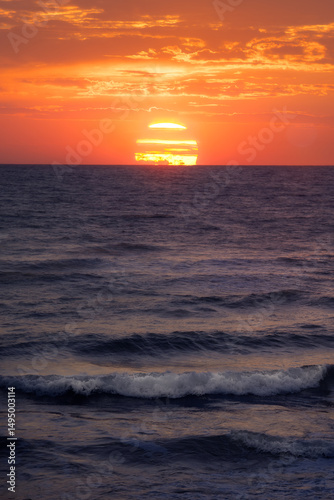 Sunset Paints the Ocean Horizon in Golden Hues Over Tranquil Waves