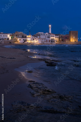 Captivating Blue Hour Glow Over Punta Secca in Sicily's Enchanting Coastal Town, Italy