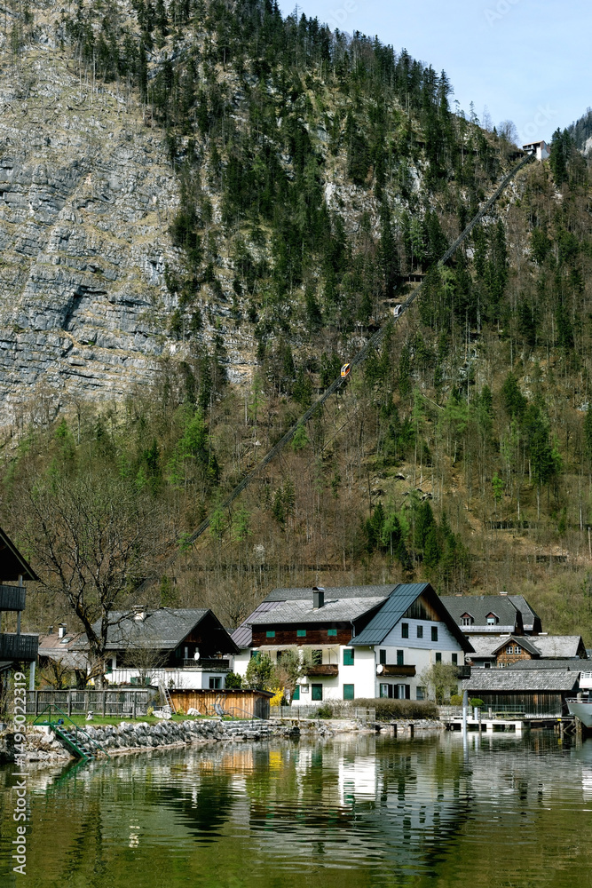 Fototapeta premium Hallstatt Austria. Alpine Village Nestled Between Mountain Cliffs