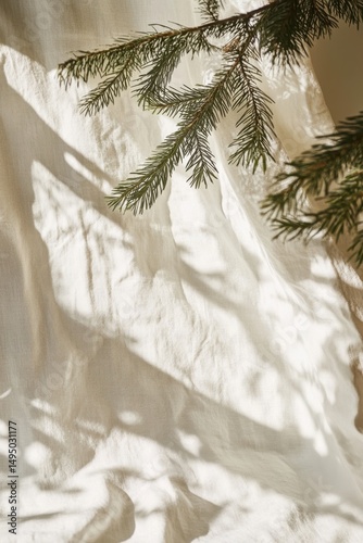 Sunlit Pine Branches Casting Shadows on Soft Textured Fabric Background.
