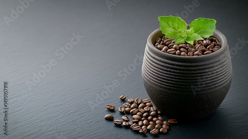 Dark ceramic bowl filled with coffee beans, fresh basil leaves on top, scattered beans on dark slate surface