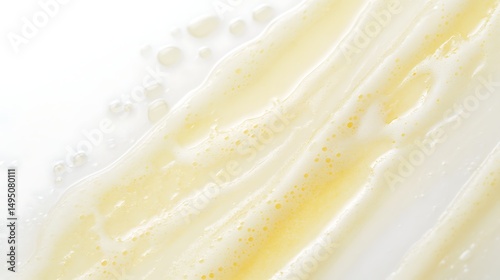 Close-up of light yellow watercolor transitions gently into a clean white background creating soft delicate streaks and a smooth minimalistic appearance with subtle gradients