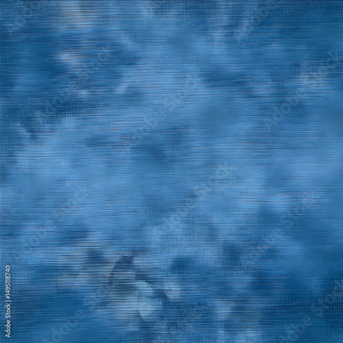 Indigo dyed canvas fabric texture with subtle tie-dye patterns. Detailed close-up view of textile surface. Fabric sample for clothing or home decor.