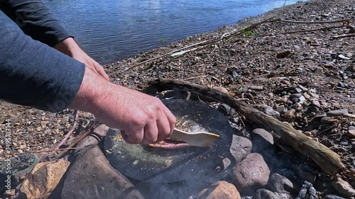 Cooking food over a fire outdoors