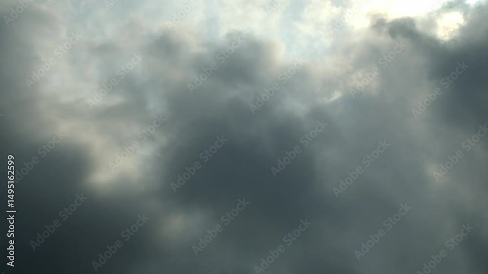 Timelapse view of dark cloudy sky moving to cover the blue sky during the day. Dark clouds before rain. Climate and weather concept. 4K footage