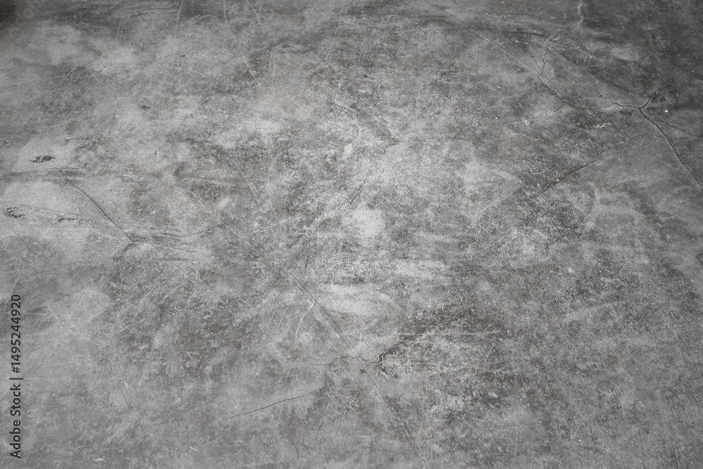 Naklejka premium A grey concrete floor with a few scratches. The floor is very smooth and has no visible lines