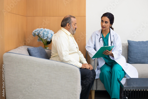 advice, consult : Hispanic female nutritionist doctor giving advice, consult to fat man stroke patient, Preventive Medicine Health Check-up in Progress