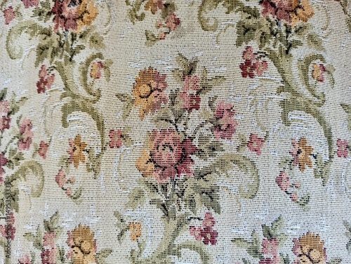 Embroidered floral pattern on tapestry, fabric background, textile texture, needlework detail, vintage style, ornamental design, decorative fabric, woven art, handcrafted pattern, traditional craft. 