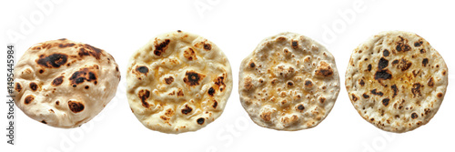 Assorted freshly baked flatbreads with varied textures and golden spots on a white background