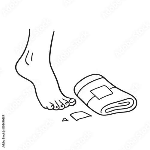 A foot toe near a fallen bandage beside a towel