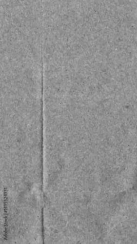 Grey kraft paper noise texture vertical stop motion video. Old page overlay effect background loop animation. Vintage paper texture with crease, stain, grain, dust particles. Empty animated backdrop