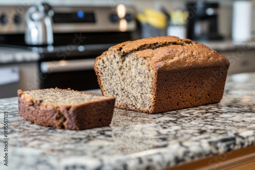 Banana bread loaf with slices on marble